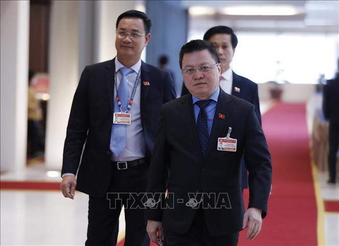 Photo: Le Quoc Minh, Member of the 13th Party Central Committee, Deputy General Director of the Vietnam News Agency attend the National Party Congress's closing session. VNA Photo