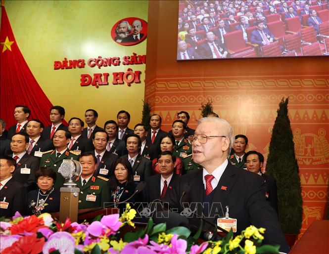 Photo: Party General Secretary Nguyen Phu Trong makes a speech on behalf of the 13th Party Central Committee. VNA Photo
