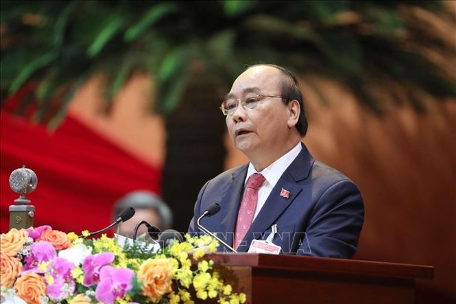 Trong ảnh: Đồng chí Nguyễn Xuân Phúc, Uỷ viên Bộ Chính trị, Thủ tướng Chính phủ thay mặt Đoàn Chủ tịch đọc Diễn văn khai mạc Đại hội, sáng 26/1/2021. Ảnh: TTXVN