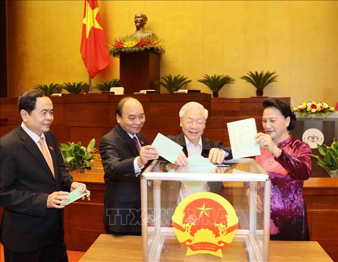 Photo: Party General Secretary and President Nguyen Phu Trong (C) casts his ballot to elect heads of the NA and the NEC. VNA Photo