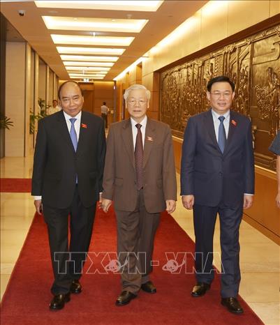 Trong ảnh: Tổng Bí thư, Chủ tịch nước Nguyễn Phú Trọng, Thủ tướng Chính phủ Nguyễn Xuân Phúc và Chủ tịch Quốc hội Vương Đình Huệ tại kỳ họp. Ảnh: Trí Dũng - TTXVN