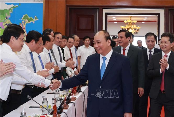 Photo: State President Nguyen Xuan Phuc with delegates. VNA Photo: Thống Nhất