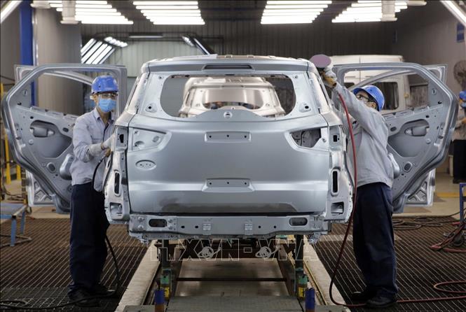 Photo: Manufacturing automobile in a factory of Ford in the northern province of Hai Duong. VNA Photo: Trần Việt