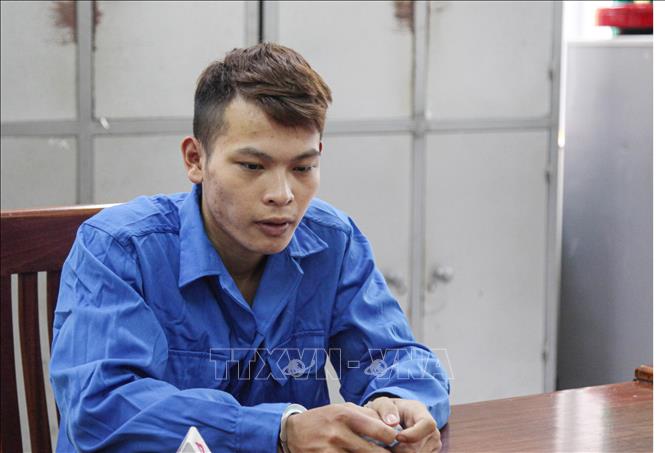 Trong ảnh: Đối tượng Nguyễn Văn Minh tại Cơ quan Công an. Ảnh: Hoàng Nguyên - TTXVN