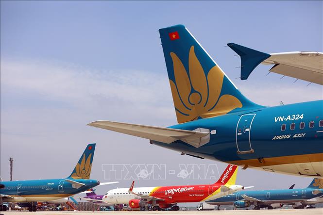 Sân bay Nội Bài không còn chỗ đỗ nên Cảng hàng không Nội Bài đã phải xin phép Cục Hàng không Việt Nam đóng toàn bộ đường lăn S1 để làm chỗ đỗ cho máy bay của các hãng. Ảnh: Huy Hùng - TTXVN