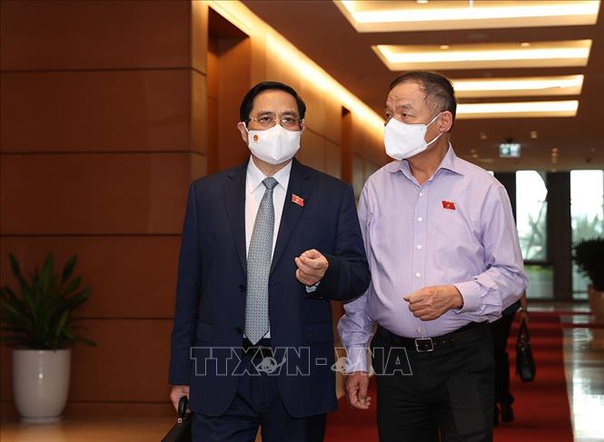 Trong ảnh: Thủ tướng Phạm Minh Chính và các đại biểu đến dự phiên họp sáng 22/7. Ảnh: Dương Giang -TTXVN