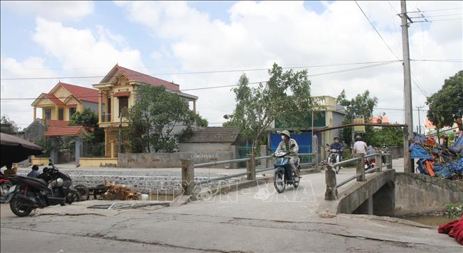 Trong ảnh: Một trong những cây cầu tại xã Khánh Trung được ông Đỗ Quang Sản sửa chữa, nâng cấp khang trang giúp người dân đi lại. Ảnh: Hải Yến-TTXVN