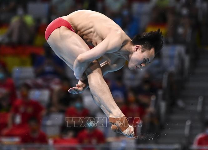 Trong ảnh: VĐV Xie Siyi của Trung Quốc thi đấu ở chung kết nội dung nhảy cầu ván mềm 3m nam tại Olympic Tokyo 2020 (Nhật Bản) ngày 3/8/2021. Ảnh: THX/TTXVN