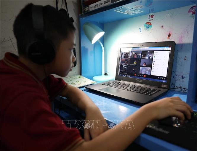 Trong ảnh: Học sinh lớp 3, trường Vinschool - Times City tựu trường theo hình thức trực tuyến. Ảnh: Thanh Tùng - TTXVN