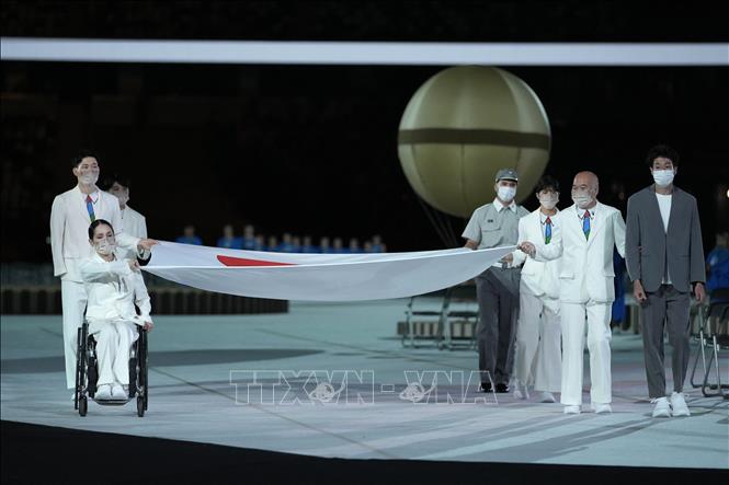 Trong ảnh: Lễ thượng cờ Nhật Bản tại lễ khai mạc Paralympic Tokyo 2020 ở thủ đô Tokyo, Nhật Bản, ngày 24/8/2021. Ảnh: AFP/ TTXVN