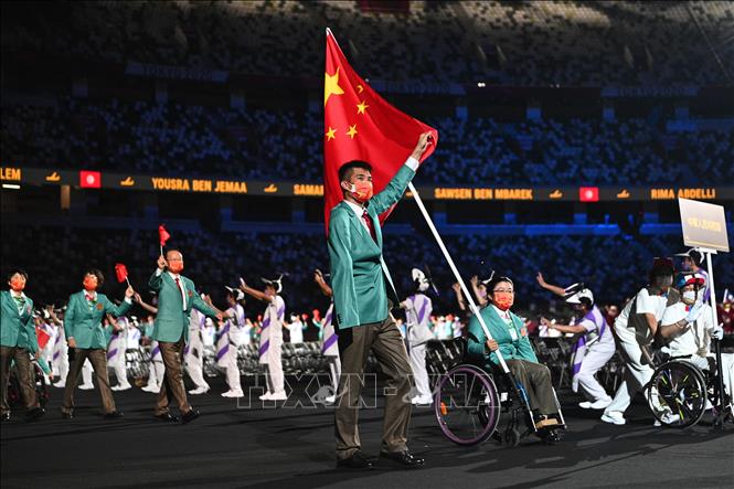 Trong ảnh: Đoàn thể thao Trung Quốc diễu hành tại Lễ khai mạc Paralympic Tokyo 2020 ở Tokyo, Nhật Bản, ngày 24/8/2021. Ảnh: AFP/ TTXVN