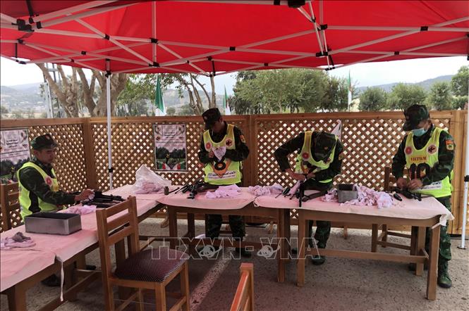 Photo: Vietnamese AK rifle team before the contest. VNA Photo: Tấn Đạt