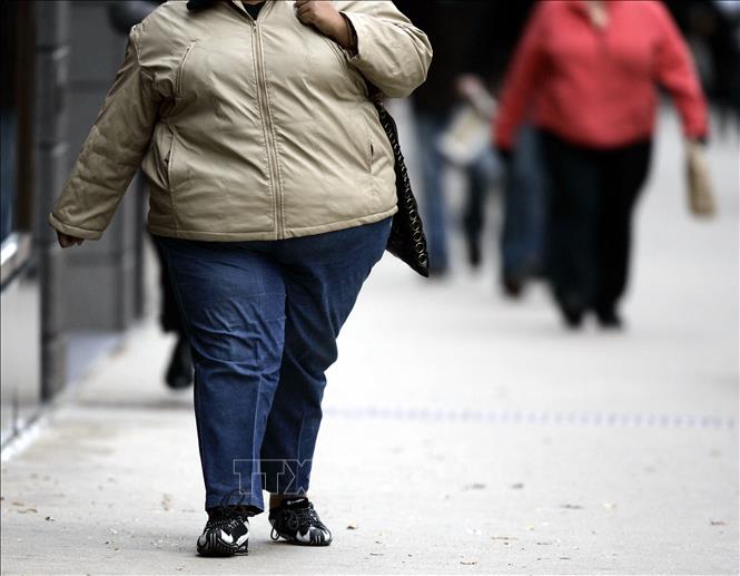 Trong ảnh: Một phụ nữ bị mắc bệnh béo phì  tại Chicago, bang Illinois, Mỹ. Ảnh: AFP/TTXVN