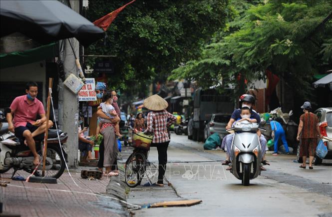 Trong ảnh: Cuộc sống đã dần trở lại với người dân phường Chương Dương. Ảnh: Thành Đạt - TTXVN