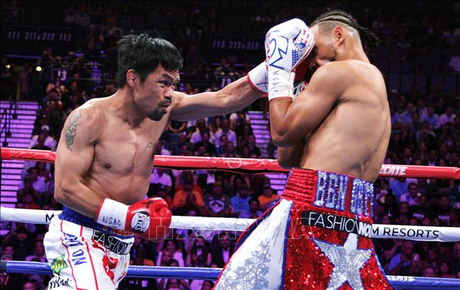 Trong ảnh: Võ sĩ quyền anh Philippines Manny Pacquiao (trái) trong trận đấu gặp võ sĩ Mỹ Keith Thurman tại Las Vegas, Nevada (Mỹ) ngày 20/7/2019. Ảnh: AFP/TTXVN