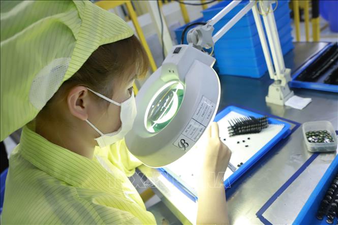 Photo: A production line of the Optrontec Vina Co. Ltd. in the Binh Xuyen IP. VNA Photo: Hoàng Hùng