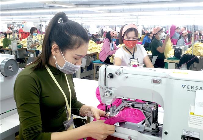 Photo: A production line of the Vina Korea Co. Ltd. in the Khai Quang IP. VNA Photo: Hoàng Hùng