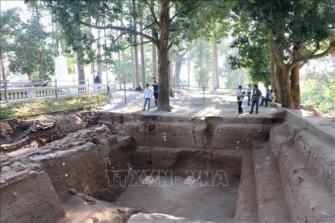 Photo: An excavation site at the Linh Son ancient pagoda which is located within the Oc Eo archaeological site. VNA Photo