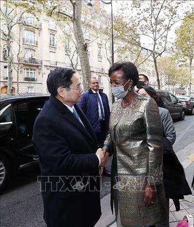 Trong ảnh: Bà Louise Mushikiwabo, Tổng Thư ký Tổ chức quốc tế Pháp ngữ (OIF) đón Thủ tướng Phạm Minh Chính. Ảnh: Dương Giang-TTXVN