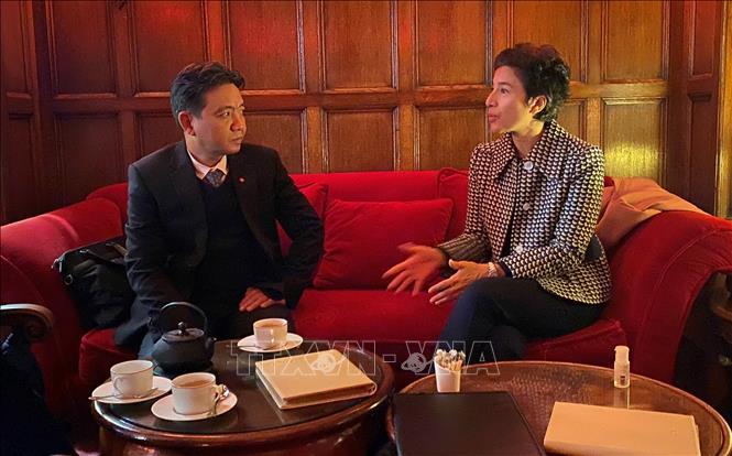 Photo: Vietnamese Deputy Minister of Culture, Sports and Tourism Hoang Dao Cuong has a working session with President of the French Institute Eva Nguyen Binh. VNA Photo: Xuân Đông 