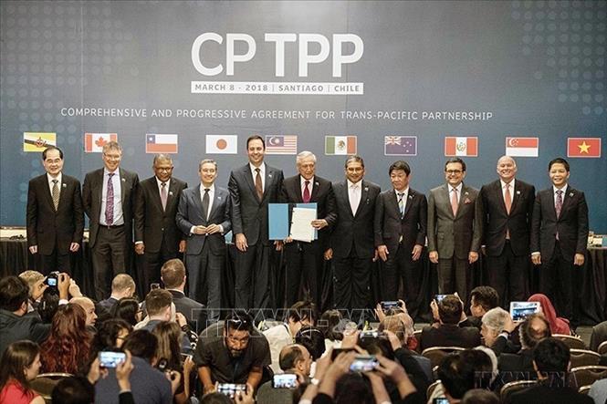 Photo: A view of the signing ceremony of the Comprehensive and Progressive Agreement for Trans-Pacific Partnership (CPTPP) in Santiago, Chile on March 8, 2018. The CPTPP was signed by 11 member countries, among which Vietnam was considered an active participant in negotiating and signing of the agreement. VNA Photo: Xinhua/VNA