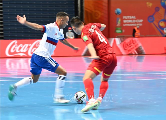 Vietnamese player and his Russian rival in a match at the finals of a FIFA Futsal World Cup.