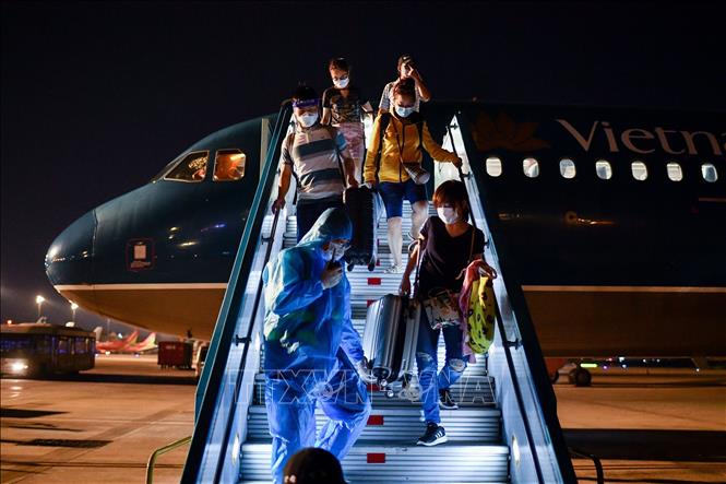 Photo: Vietnam Airlines’ plane lands at Tan Son Nhat International Airport. VNA Photo
