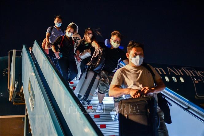 Photo: Vietnam Airlines’ plane lands at Tan Son Nhat International Airport. VNA Photo
