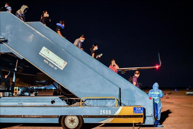Photo: Vietnam Airlines’ plane lands at Tan Son Nhat International Airport. VNA Photo