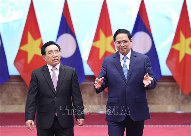 Thủ tướng Phạm Minh Chính và Thủ tướng Lào Phankham Viphavanh dự Lễ phát động Năm Đoàn kết Hữu nghị Việt Nam - Lào, Lào - Việt Nam 2022. Ảnh: Dương Giang-TTXVN