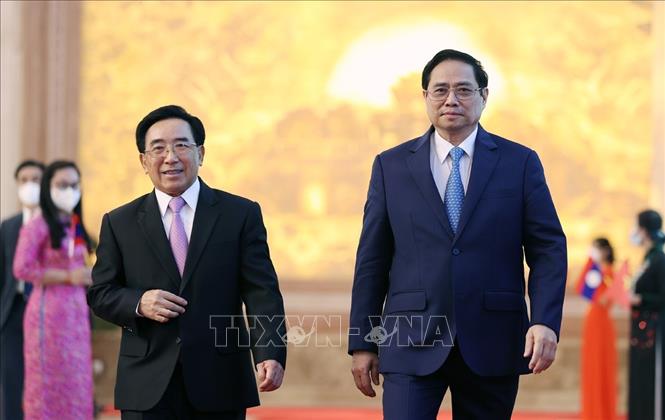 Thủ tướng Phạm Minh Chính và Thủ tướng Lào Phankham Viphavanh dự Lễ phát động Năm Đoàn kết Hữu nghị Việt Nam - Lào, Lào - Việt Nam 2022. Ảnh: Dương Giang-TTXVN