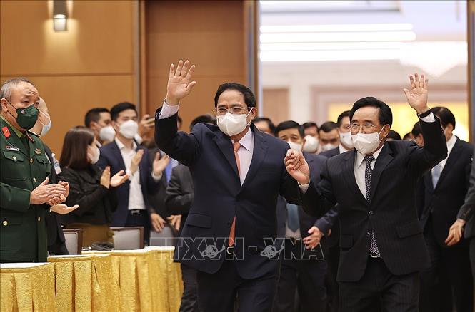 Trong ảnh: Thủ tướng Phạm Minh Chính và Thủ tướng Lào Phankham Viphavanh đến buổi gặp gỡ. Ảnh: Dương Giang-TTXVN