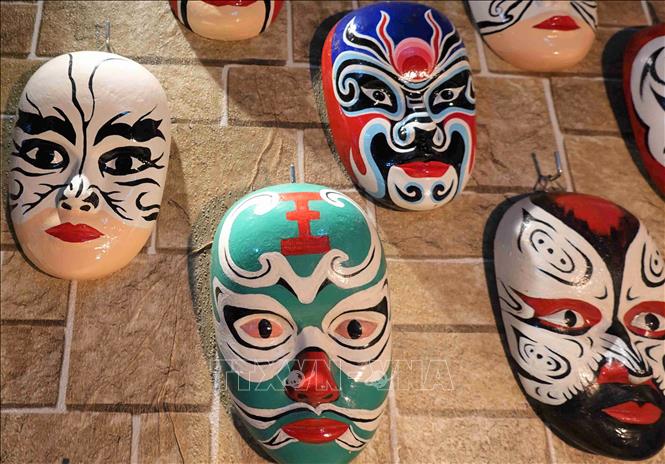Photo: Masks made by Tran Ngoc Van, inspired by Hat Boi's characters' emotions and expressions. VNA Photo: Tường Quân 