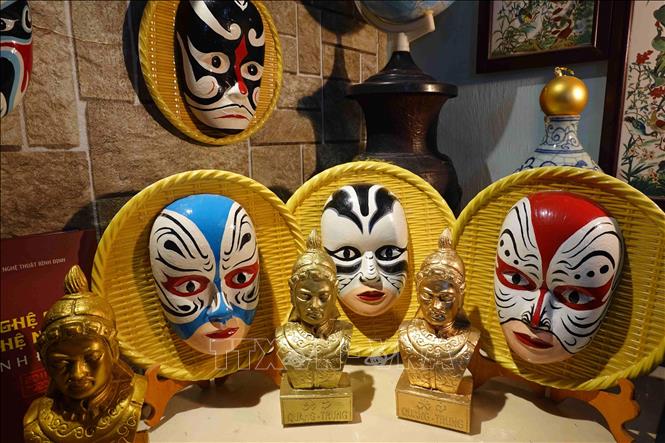 Photo: Masks made by Tran Ngoc Van, inspired by Hat Boi's performance masks. VNA Photo: Tường Quân 