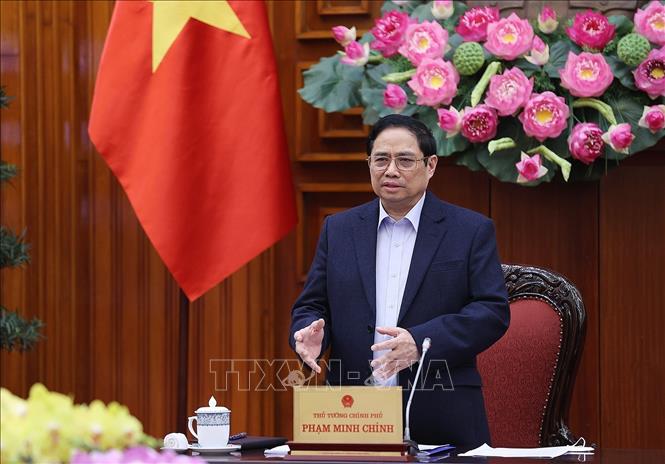 Photo: PM Pham Minh Chinh speaks at the meeting. VNA Photo: Dương Giang