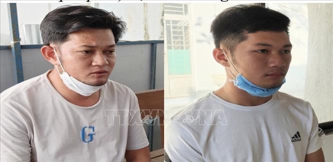 Trong ảnh: Bị can Phi (bên trái) và Hậu tại cơ quan điều tra. Ảnh: TTXVN phát./.