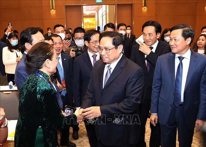 Trong ảnh: Thủ tướng Phạm Minh Chính gặp mặt kiều bào dự Xuân quê hương năm 2022. Ảnh: Dương Giang-TTXVN