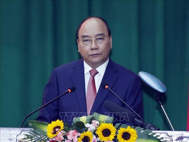 Photo: State President Nguyen Xuan Phuc extends Tet greetings to Ho Chi Minh City police force. VNA Photo: Thống Nhất 