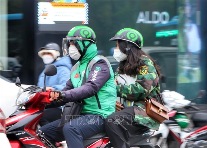 Dịch vụ xe ôm công nghệ được hoạt động trở lại sau hơn 6 tháng. Ảnh: Tuấn Đức - TTXVN