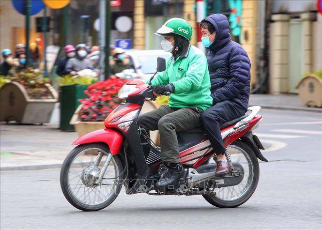 Dịch vụ xe ôm công nghệ được hoạt động trở lại sau hơn 6 tháng. Ảnh: Tuấn Đức - TTXVN