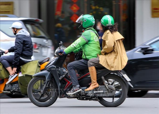 Dịch vụ xe ôm công nghệ được hoạt động trở lại sau hơn 6 tháng. Ảnh: Tuấn Đức - TTXVN