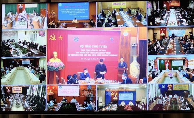 A video conference on presentation of social, health insurance books to needy people is held on February 22.