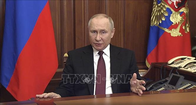 Trong ảnh: Tổng thống Nga Vladimir Putin trong bài phát biểu được truyền hình trên toàn quốc ngày 24/2/2022. Ảnh: AFP/TTXVN