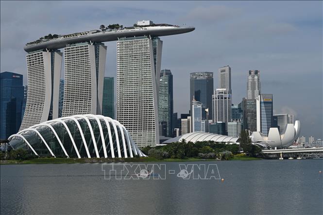  Trong ảnh: Các tòa nhà cao tầng tại một quận tài chính ở Singapore. Ảnh: AFP/TTXVN
