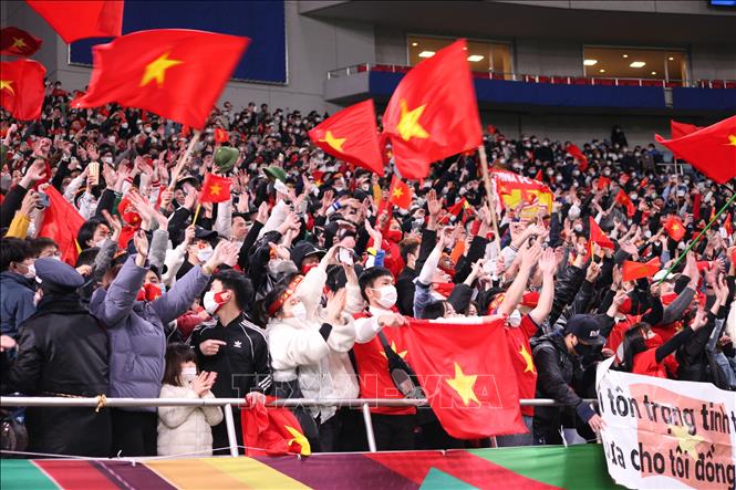 Photo: Vietnamese fans cheer for national team at Saitama stadium. VNA Photo: Đào Thanh Tùng
