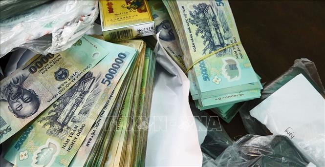 Tang vật vụ đánh bạc bị công an thu giữ tại hiện trường. Ảnh: TTXVN phát