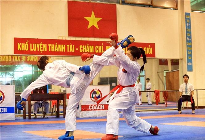 Trong ảnh: Một đòn đánh trong thi đấu nội dung đối kháng. Ảnh: Tuấn Anh - TTXVN