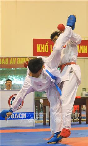 Trong ảnh: Tập luyện thi đấu nội dung đối kháng. Ảnh: Tuấn Anh - TTXVN