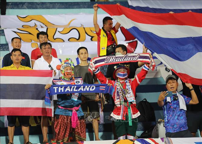 ​​​​​​​Thai supporters cheer for their team at the game. VNA Photo 