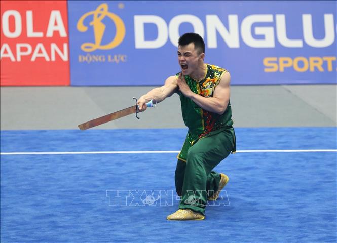 VĐV Nông Văn Hữu (Việt Nam) với bài biểu diễn nội dung Nam đao nam đạt 9,67 điểm, giành HCĐ. Ảnh: Phạm Hậu - TTXVN
